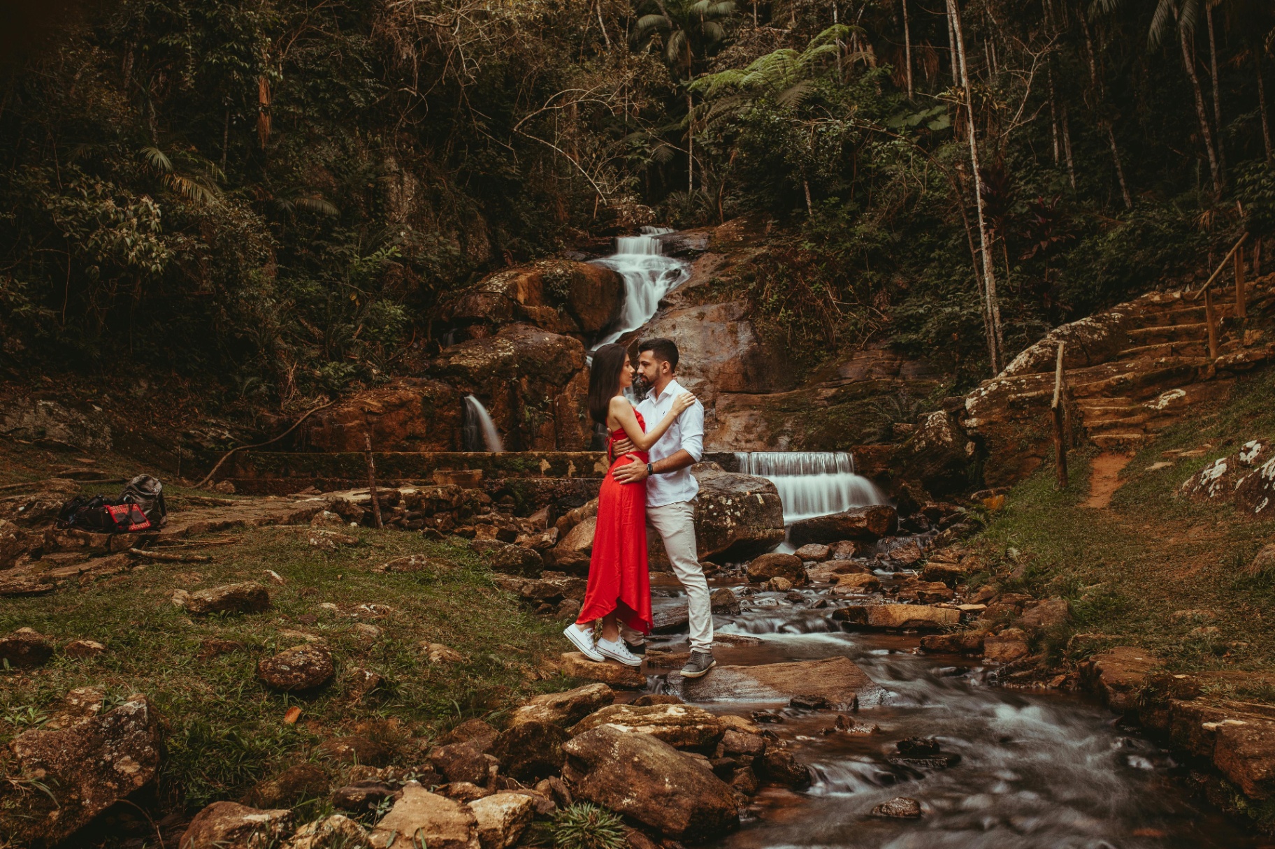 Soria and Antoine embracing at golden hour